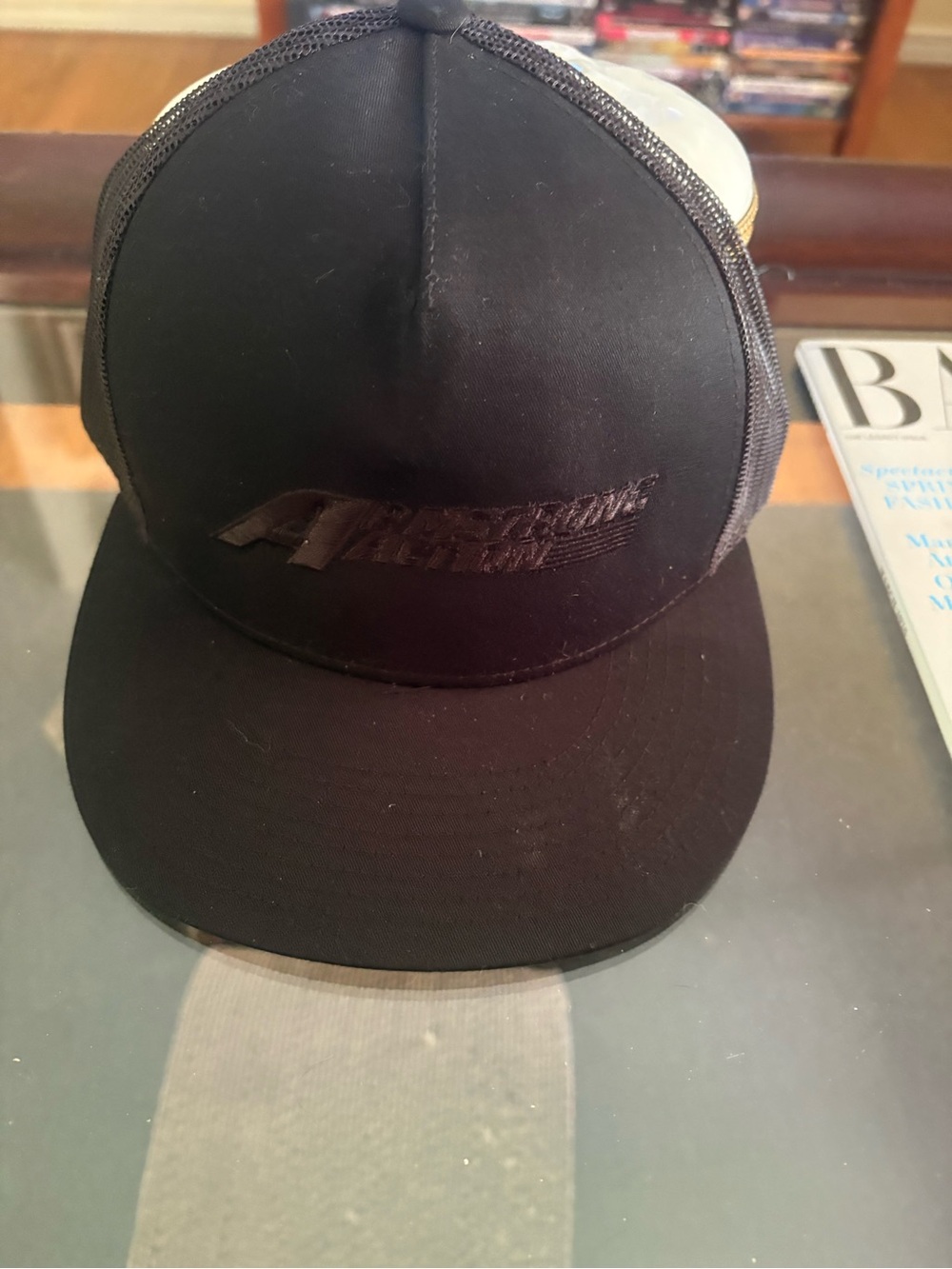 Cap from Fear 4 of walking Dead , Black and says Armstrong Action.